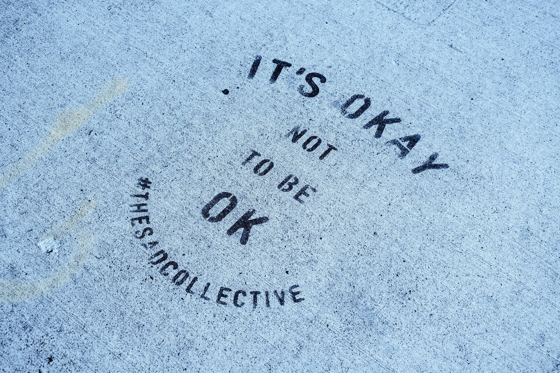 inspirational message on blue concrete pavement
