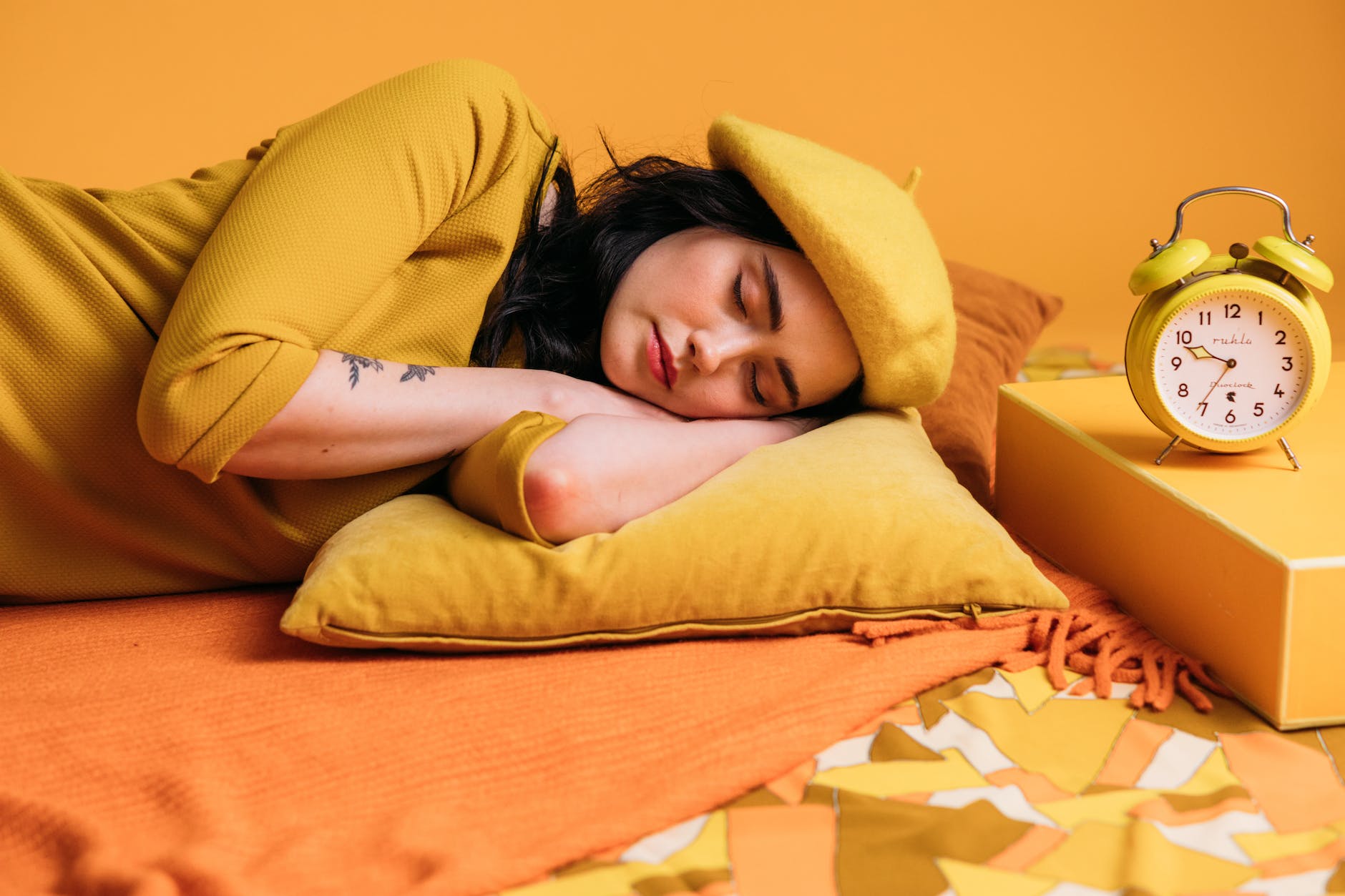 a sleeping woman in yellow outfit
